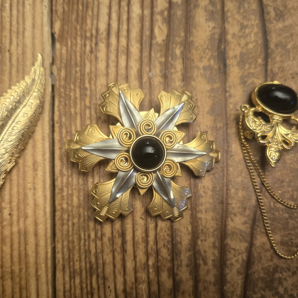 Gold and Silver Brooch with Black Center